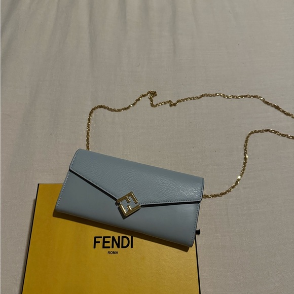 BRAND NEW FENDI LEATHER NAPPA FF BLUE BAGUETTE CHAIN BAG  Fendi Sky Blue Leather Clutch with Gold Chain